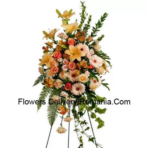 Un bel arrangement floral de condoléances qui vient avec un support