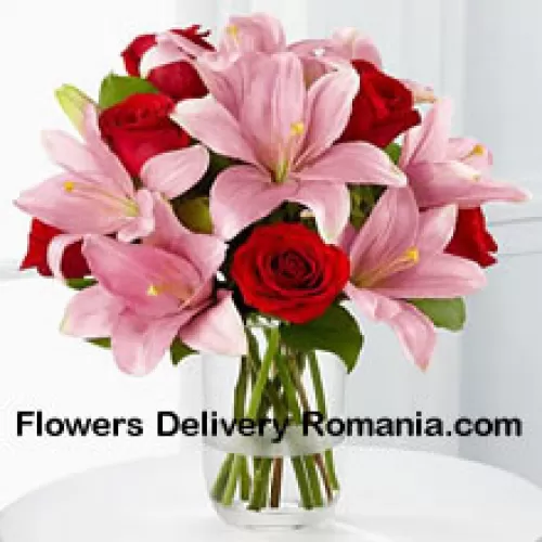 Red Roses And Pink Lilies With Seasonal Fillers In A Glass Vase